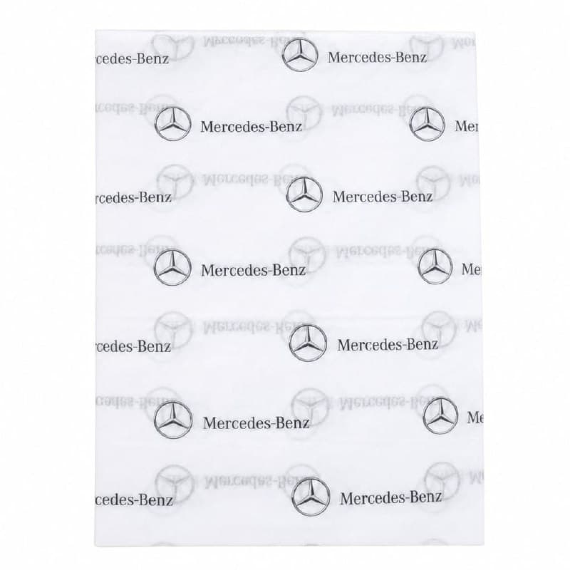 Mercedes-Benz branded white tissue paper printed with a repeating grid of the three-pointed star and word-mark in soft-touch matte black — designed and made by Sense2.