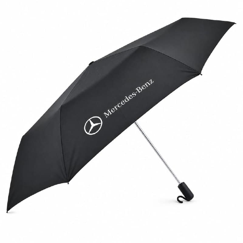 Mercedes-Benz branded black umbrella with white three-pointed star and word-mark on the canopy, wind-tested fibreglass ribs, double-vented canopy — designed and made by Sense2 for Mercedes-Benz.